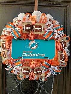 a football wreath with the name dolphins on it