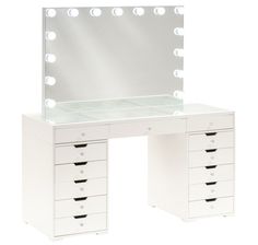 a white vanity table with drawers and lights on the top, in front of a mirror