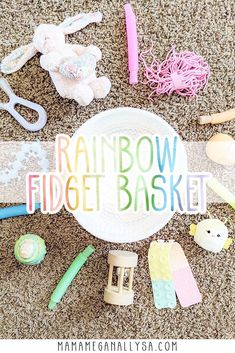 a pile of toys sitting on top of a carpet next to a sign that says rainbow fidget basket