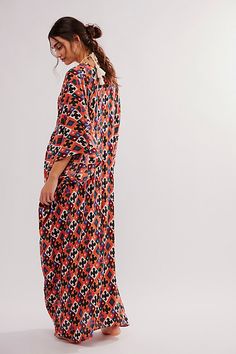 Billowy and breezy, vibrant and eye-catching, this so special kaftan is perfect for brunches, beach days, and everything in between. **Fit:** Maxi length, relaxed and oversized **Features:** Super mod, retro print, relaxed sleeves, pull-on style, deep-v neckline, ruched detailing, soft comfy fabrication **Why We | Groovy Baby Maxi Kaftan Dress by Free People Maxi Length Beachwear Cover-up For Brunch, Bold Dresses For Spring Vacation, Bold Summer Vacation Dresses, Bold Print Summer Beach Dresses, Vibrant Print Maxi Dress For Beach, Vibrant Print Maxi Dress For Brunch, Summer Maxi Dress With Vibrant Print For Brunch, Summer Dresses With Abstract Print And Kimono Sleeves, Multicolor Relaxed Fit Maxi Dress For Summer