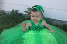 Welcome to Little Dreams by Mayra This dress is gorgeous and very puffy! made with soft tulle, skirt has three layers of tulle with two glitter lucky leaves(foam material), top has three handmade satin flowers just perfect to celebrate St. Patrick's day, will be the perfect match for your little one! Great for pictures! Head piece is included and will be your choice of hat headband or flower headband/alligator clip as showing on pictures Length of dress is from armpit to toes, you can measure yo Green Princess Tutu Dress For First Birthday, Green Tulle Tutu Dress For Wedding, Green Tulle Skirt Tutu Dress For Wedding, Cute Fitted Green Tutu Dress, Fitted Tulle Tutu Dress For First Birthday, Fitted Green Tulle Tutu Dress, Green Fitted Tulle Tutu Dress, Green Tulle Tutu Dress, Glitter Lucky