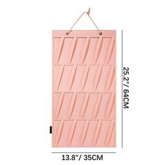 a pink wall hanging on the side of a white wall