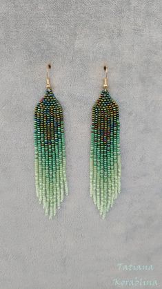 These handmade earrings are made of high-quality Czech beads and strong synthetic thread. They are elegant, fashionable, and highly versatile, suitable for everyday wear. Color: green,mint ,herbal. There may be some color discrepancies which is due to the different monitor settings 100% hand made with love! Measurements: Length-about  11.5cm (4.33 inch) Width -about  2 cm (0.79 inch) Materials: Sterling silver components Czech glass beads Strong bead weaving thread Handmade Green Bohemian Tassel Earrings, Green Fringe Beaded Drop Earrings, Elegant Green Beaded Earrings With Tassels, Green Dangle Tassel Earrings With Fringe, Green Tassel Drop Earrings With Dangling Beads, Green Tassel Beaded Drop Earrings, Green Tasseled Beaded Drop Earrings, Bohemian Green Beaded Tassel Earrings, Green Beaded Drop Tassel Earrings