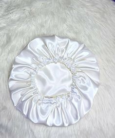 Our beautiful silky-smooth reversible satin hair Bonnet is handmade with  Premium quality satin fabric. Great way to protect your hairstyle day time and night. Very comfortable to wear made with 100% polyester Ideal for night sleep and to protect hairstyle. PLEASE NOTE: WE ARE SO CONFIDENT IN OUR PRODUCT, 30 DAYS MONEY BACK GUARANTEE  Small size: 21 inches (elastic) Medium size: 21 inches (elastic)  Larger size: 21 inches (elastic) If you require different sizes than what we have listed above. Send us a message with your order and the size you want.  Our Bonnet Sizing Guide for your comfort. SMALL Short hairstyle Cornrows Afro Short natural hair MEDIUM Shoulder length hair Crochet hairstyle Medium afro hairstyle Mid-length back hair LARGE Long braids Long natural hairstyle Thick volumised Satin Hair Bonnet, White Bonnet, Birthday Haul, Sleep Hat, Silk Bonnet, Satin Bonnet, Hair Bonnet, Shower Caps, Gift For Wedding