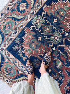 a person standing on top of a rug