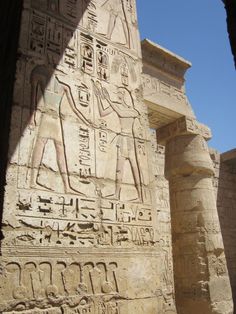 an ancient egyptian carving on the side of a building