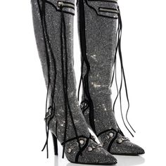 A Boot Is Something That Can Actually Be So Personal. The Azalea Wang " The Monarch Maverick " Stiletto Boot In Silver Is A Sparkling Rhinestone-Embellished Boot Featuring A Pointed Toe Silhouette, A Faux Suede Base, A Slim Stiletto Heel, And A Knee-Height Shaft. Complete With Faux Buckle Accents Throughout, Faux Silver Metallic Hardware, Top Zip Detailing, Tassel Trim, An All-Over Rhinestone Design, And A Classic Inner Ankle Zipper Closure. Style With A Sleek Mini Skirt And A Faux Leather Jacke Silver Heels With Bling, Silver Bling Heels With Fitted Design, Fitted Silver Heels With Bling, Silver Winter Boots For Formal Occasions, Silver Boots For Formal Winter Occasions, Silver Heels For Evening In Fall, Silver Bling Boots For Evening, Silver Fitted Heels With Bling, Formal Silver Boots With Silver Studs