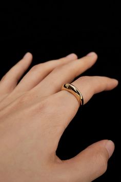 Take a spin with the Tilda Modern Mobius Ring in Gold! This abstract bubble ring adds a touch of sleekness to your style. Its medium band width allows for versatile wear whether alone, doubled up, or stacked with other rings. With 18K PVD gold plating, it's also water proof - perfect for a swim. Modern Adjustable Stackable Wide Band Ring, Modern Twist Open Dome Ring For Formal Occasions, Modern Twist Open Design Dome Ring For Formal Occasions, Modern Twist Formal Open Dome Ring, Modern Wide Stackable Bands, Modern Adjustable Stackable Dome Ring, Modern Twist Everyday Rings With Round Band, Modern Twist Round Band Rings For Everyday, Modern Adjustable Dome Ring With Open Band