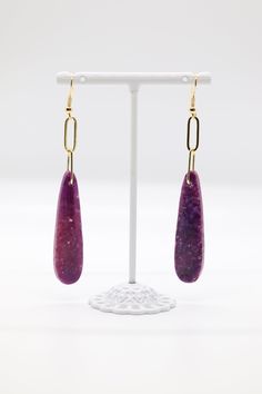 The "Variety Teardrop Geometric Natural Stone Amethyst Imperial Jasper Drop Paperclip Dangle Earrings" are a versatile and eye-catching accessory featuring a combination of teardrop, geometric, and paperclip elements adorned with natural stone beads like amethyst and imperial jasper. These earrings offer a unique blend of shapes and colors, making them a captivating choice for those who appreciate distinct and eclectic jewelry. Purple Teardrop Metal Earrings, Purple Dangle Teardrop Earrings With Ear Wire, Handmade Purple Drop Clip-on Earrings, Eclectic Jewelry, Imperial Jasper, Natural Stone Beads, Raw Stone, Feather Earrings, Paper Clip