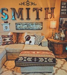 a living room filled with lots of furniture and decor on top of carpeted flooring