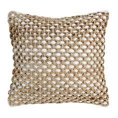 a beige and white pillow on a white background