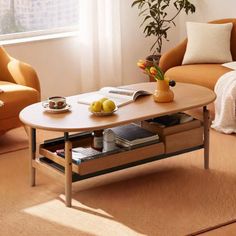 a living room with two couches and a coffee table in the middle of it