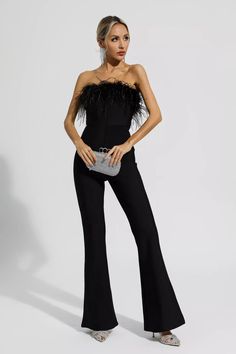 Our Lilith Black Bandage Jumpsuit will be your best choice for dinners or everyday occasions. The feather tube top design is made of elastic bandage fabric to shape charming curves. The pants are cut in a straight-leg silhouette and have a slightly flared hem to elongate the leg. Style it with a blazer or heels for a chic look. Why don't you try it?  Length: Approx 122cm Materials: Bandage (73.6% Viscose, 24% Polyester, 2.4% Spandex) Gentle Dry Clean Only  The model is 5 ft 7 and wears size M  C Old Hollywood Women, Feather Tube Top, Feather Jumpsuit, Long Black Jumpsuit, Jumpsuit Wedding Guest, Jumpsuit Wedding, Derby Attire, Hoco Inspo, Jumpsuit For Wedding Guest