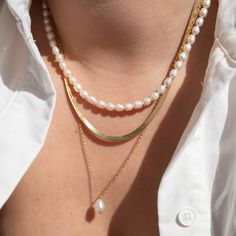 *Buy 2 items, Get 15% OFF your order. Coupon applied at checkout.* Luxurious freshwater pearl necklace. Carefully hand selected cultured fresh water pearls. Pearls are delicate by nature, so handle with care. Our Pearl necklaces are great for wearing by itself or layering. Also makes for the perfect gift! - 18k gold filled - Freshwater pearls - Water resistant / Tarnish resistant / Hypoallergenic - 1 year warranty Pearl Strand Necklace: - Pearl strand thickness: 3.6mm - Adjustable chain 16 to 18 Layering Necklaces With Pearls, Pearl Necklace Combination, Necklace Layering Pearls, Layered Necklaces With Pearls, Gold Pearl Necklace Set, Pearl Necklace Combo, Pearl And Gold Necklace Layering, Layering Pearl Necklaces, Everyday Pearl Charm Necklace For Mother's Day