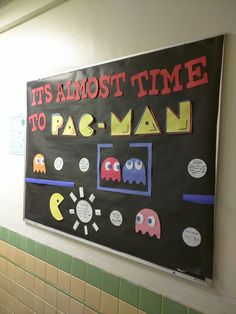 a bulletin board that says it's almost time to pac - man on the wall