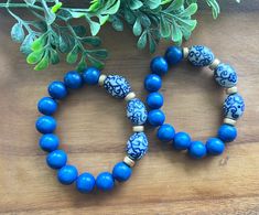 Such gorgeous shades of royal blue wood beads paired with floral blue and white ceramic chinoiserie beads.  Bracelet measures appropriately 7.5 or 8 inches. Message me if you need a different size! Thanks so much for stopping by Beaded Blues! Adjustable Blue Beaded Bracelets With Wooden Beads, Blue Wooden Beaded Bracelets As Gift, Blue Stretch Bracelet With Round Wooden Beads, Blue Wooden Beads Stretch Bracelet, Blue Wooden Beads Stretch Bracelet As Gift, Adjustable Blue Stretch Bracelet With Wooden Beads, West Lafayette, Blue Chinoiserie, Blue Beaded Bracelets