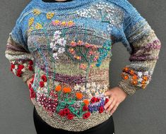 A sweater depicting a meadow full of flowers. 100% handicraft, knitted from cotton and wool. The landscape is embroidered by hand. The sweater is soft and pleasant to the touch. Length 63 cm, circumference 110 cm. Fits S, M, L figures. Sweater Painting, Landscape Sweater, Flowery Meadow, The Landscape, Embroidered Flowers, Women Pullover, Shades Of Green, Hand Embroidered, Sweater Outfits