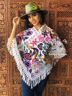 This beautiful Traditional Poncho is completely unique in both design and embroidery. It has a beautiful embroidered Peacock Design. It is Hand embroidered by Cross Stitch with details in cotton made on a loom. It comes in one size which fits sizes Small, Medium, Large and Extra Large. Bohemian Shawl With Floral Embroidery For Festival, Bohemian Floral Embroidered Shawl For Festival, Multicolor Floral Embroidered Festival Shawl, Multicolor Floral Embroidered Shawl For Festival, Traditional Poncho With Floral Embroidery, Festival Poncho With Multicolor Floral Embroidery, Bohemian Multicolor Floral Embroidered Poncho, Festival Colorful Floral Embroidered Poncho, Traditional Floral Embroidered Poncho