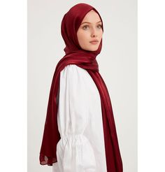 Shine Hijab Shawl - Burgundy Glossy in texture and elegant in appearance, our shine shawl is set to be the next great addition to your wardrobe! Its sleek shine makes for an impressive final touch to formal wear so you could look and feel your best on any special occasion. FEATURES: - Glossy finish - Suitable for all seasons - Opaque (not transparent) MATERIAL: - 75 cm x 185 cm - Polyester CARE: - Hand wash separately in cold water. - Lay flat to dry. - Iron on low without steam. Made in Turkey Elegant Shawl For Eid And Formal Occasions, Elegant Shawl For Formal Eid Occasions, Elegant Formal Shawl For Eid, Elegant Wedding Hijab, Elegant Formal Shawl For Festive Occasions, Elegant Festive Shawl For Formal Occasions, Elegant Formal Festive Shawl, Formal Solid Color Satin Scarves, Elegant Red Scarf For Festive Season