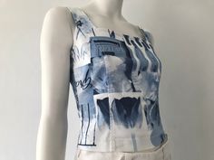 Vintage KENZO blue and white printed cotton top Square neckline Sleeveless Side zipper fastening Attractive all over print in blue and white, featuring  charming images and scripts ( postes box, wine bottles, tulips) of Life in Paris  Cotton drill, elastane Circa 1990s by KENZO jeans Excellent vintage condition  Size: marked f38 Bust 36" Waist 28" Shoulder 13 1/2" Length from shoulder 18" The Mannequin shown wearing the garment is approx UK size 8 -10 (EU 40)  Bust 33"  Waist 25 1/2"  Hip 35" Pretty Summer Tops, Vintage Bustier, Vintage Vest, Designer Vintage, Top Vintage, Bustiers, Summer Top, Cotton Tops, Vintage Tops