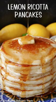 A stack of six pancakes on a plate with syrup being poured on it and lemon in the background. Lemon Ricotta Pancakes Recipe, Yummy Pancake Recipe, Light And Fluffy Pancakes, Berry Pancakes, Lemon Ricotta Pancakes, Blueberry Topping, Ricotta Pancakes, Lemon Ricotta, Fluffy Pancakes