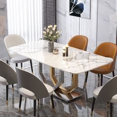 a marble dining table surrounded by beige chairs