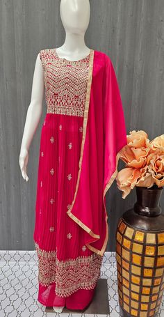 Get ready to make a statement at your next celebration with the Nyra Cut Suits Indian Party Wear Dress with Dupatta in Size 38. This ensemble features a palazoo bottom style and a glamorous fit that will make heads turn. The fashionable style and fashionable wear of this dress make it the perfect choice for any celebration. With its elegant ensemble and celebration glam, you'll be sure to make a lasting impression. Don't miss out on showcasing your celebration style in this unforgettable attire. Semi-stitched Party Sets For Diwali, Festive Semi-stitched Dress With Dupatta, Sleeveless Georgette Dress For Eid, Summer Floor-length Dress With Pallu, Summer Festive Anarkali Gown, Bollywood Summer Dresses With Pallu, Embellished Fitted Dresses For Eid, Pink Party Kurta With Zari Work, Sleeveless Salwar Kameez For Party