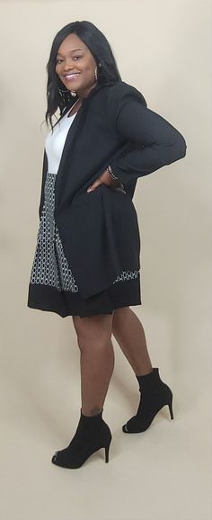 An Alluringly Solid Open-Front Blazer adorned with chic Fake Pockets and Puffy Long Sleeves, finished with a Collared Flair. Model is wearing an Extra Large (for layering). Model fits a Large (Waist: 33", Hips: 44", Bust: 39", Height: 5'5") Material: 95% POLYESTER, 5% SPANDEX Color: Black Elegant Fitted Cardigan For Work, Elegant Black Cardigan For Business Casual, Fitted Black Cardigan For Business Casual, Fitted Cardigan For Office, Elegant Fitted Black Cardigan, Stretch Cardigan For Workwear, Elegant Stretch Outerwear For Layering, Elegant Stretch Cardigan For Layering, Fitted Black Cardigan For Office