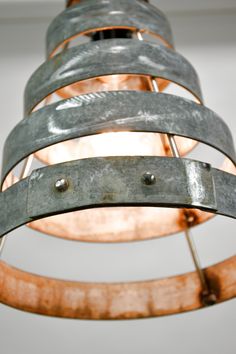 a metal light fixture hanging from the ceiling