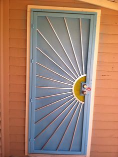 a blue door with a yellow handle on it