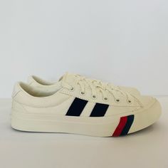 A Classic Cotton Canvas Upper With Red And Blue Powerstripe Details. Rubber Sole. Spot Wash, Air Dry Only. Unisex. Men Size 7 And Women Size 9. No Original Box. White Casual Sneakers With Signature Stripes, Casual White Sneakers With Signature Stripes, Sporty Striped Sneakers With Round Toe, Casual Sneakers With Signature Stripes And Round Toe, Striped Sporty Sneakers With Round Toe, Casual Striped Sneakers For Spring, Sporty Striped Sneakers For Streetwear, Casual Striped Low-top Sneakers, Sporty Striped Low-top Sneakers