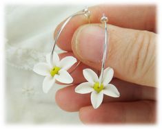 Very lightweight delicate hand sculpted Jasmine hoop earrings. Available in 925 sterling silver or 14k gold filled hoops. -Original hand sculpted polymer clay flowers -Durable, water-resistant -No molds, no paint -Hoop size : 1 inch -Flower size : 18mm -20 gauge hoops - choose 925 sterling silver or 14k gold filled View matching collection at: https://www.etsy.com/shop/strandedtreasures/search?search_query=jasmine Flowers are hand sculpted without molds or paint using polymer clay, a durable wat White Sterling Silver Hoop Earrings For Anniversary, Delicate White Hoop Earrings For Gifts, Delicate White Hoop Earrings With Ear Wire, Dainty White Hoop Earrings For Anniversary, Anniversary White Sterling Silver Hoop Earrings, Delicate Hoop Flower Earrings For Gifts, Nickel Free Small Hoop White Jewelry, White Sterling Silver Hoop Earrings As Gift, Delicate Flower Hoop Earrings For Gift