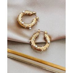 Step out in style with the Eleanor French Pearl Hoop Earrings. Crafted from 18K gold-plated metal with exquisite pearl details, these unique earrings will elevate your look every day. Waterproof and designed to last, show off your sense of style with these beautiful hoops. • Length: 1" • Pearl & Crystal • 18k Gold plated • Waterproof • Non-tarnishing • Hypoallergenic Pearl Details, Pearl Crystal, Pearl Hoop Earrings, Elevate Your Look, Unique Earrings, 18k Gold, Gold Plate, Hoop Earrings, Plating