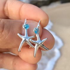 antique silver starfish on  elegant hypoallergenic stainless steel french hook ear wires choose from the following glass accent bead colors: * transparent aqua blue * transparent deep ocean blue  * get a great deal on both! * for a limited time get a free starfish wish bracelet! Handmade by me with Aloha in Hawaii PLEASE MESSAGE ME FOR LARGER QUANTITY OR DIFFERENT COLOR ACCENT BEADS they arrive ready for gifting inside a delicate deep ocean blue organza bag.  *to ensure safety in transit, earrings are now shipped inside a cute, reusable acrylic jar along with my Live Aloha card and organza bag* SEE ALL MY EARRINGS HERE: https://www.etsy.com/shop/LOphoto808?ref=br_feed_17&br_feed_tlp=art§ion_id=17783609 shipping additional items is FREE!! please contact me here: https://www.etsy.com/convers Starfish-shaped Earrings With Star Charm For Gift, Starfish Earrings With Star Charm As Gift, Nickel-free Ocean-inspired Earrings For Gift, Ocean-inspired Silver Jewelry For Beach Season, Silver Earrings With Starfish Charm As Gift, Ocean-inspired Hypoallergenic Jewelry As A Gift, Ocean-inspired Hypoallergenic Jewelry Gift, Starfish Nickel-free Earrings For Gift, Starfish-shaped Nickel-free Earrings For Gifts