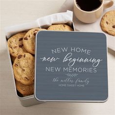 a cookie tin filled with cookies next to a cup of coffee