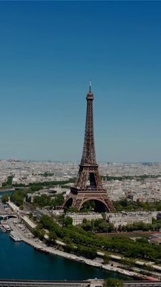 the eiffel tower towering over the city of paris, france is seen from above