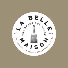 a white and black logo for a paintbrush company with the words, la bellee maison on it