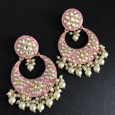 Meenakari Kundan Jadau Chandbali Earrings with Pearl beads Premium Quality Meenakari Kundan Chandbali Earrings Length: Approx. 2.75" Light-weight Push-Back closure with back clip for extra support Gold Finish on high-quality brass as the base metal, Kundan stones and Pearls Suitable for any traditional for contemporary attire and occasion In-stock & ready-to-ship **Color may vary slightly due to photography and lighting. Luxury Bridal Chandbali Earrings With Cutdana, Luxury Kundan Chandbalis With Mirror Work, Luxury White Meenakari Chandbalis, Luxury Kundan Earrings With Latkans, Luxury Meenakari Chandbalis For Festivals, Luxury Kundan Meenakari Danglers, Pink Kundan Chandbali Earrings, Diwali Kundan Pearl Earrings With Meenakari, Luxury Meenakari Pearl Wedding Earrings