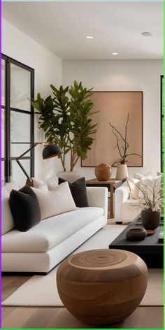 a living room filled with furniture and plants