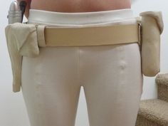 a woman with her back to the camera wearing a belt