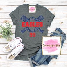 an eagle's apparel shirt, jeans and sneakers