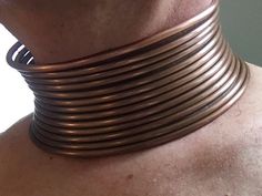 "Tribal style neck coil for the committed and creative comes to you ready to place and form for a lifestyle look... This solid copper neckpiece is a true replica of the traditional neck coils (Idzilla) made famous by natives of Africa and Southeast Asia. Just like the originals this neckpiece requires some effort to fit correctly using traditional forming techniques. Once in place these neck coils can remain as long as you like. Comfortable, durable, and distinctive the inventors of this style w Bronze Adjustable Choker, Neck Rings, Rings Style, Coil Bracelet, Metallic Copper, Inventors, Copper Red, Plastic Molds, Choker Necklaces