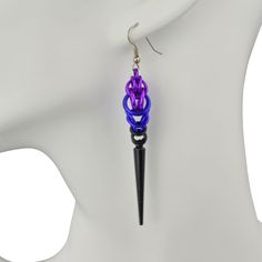 A deep, dark purple-to-black chainmaille ombre finished with a black spike. Earrings measure approximately 3.25".Aluminum links, acrylic spikes and stainless steel earwire PURPLE GOTH colorway: violet, purple, black Black Gothic Jewelry With Spikes, Black Metal Jewelry With Spikes, Black Metal Spiked Jewelry, Purple Goth, Goth Accessories, Chain Maille, Spike Earrings, Violet Purple, Purple Black