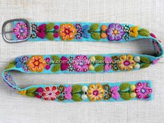 Peruvian embroidered belt floral colorfulThese belts are densely embroidered using dozens of colors naturals and each one is unique. Elegant floral design and a pleasure to wear, it will bring joy to you through its visual beauty as you will want to wear it time and time again.Each belt 5 sets of holes spaced 2" apart so they are versatile. You can wear the same belt on your waist or hips. They also stretch slightly, like a pair of jeans, and will conform to your body after a few days of wear.Si Folk Multicolor Embroidered Belt, Folk Style Multicolor Embroidered Belt, Multicolor Folk Fabric Belt, Folk Style Multicolor Fabric Belt, Multicolor Fabric Belt In Folk Style, Festival Fabric Belt With Multicolor Embroidery, Handmade Bohemian Belt With Multicolor Embroidery, Festival Multicolor Embroidery Fabric Belt, Handmade Multicolor Belt For Festivals