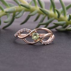 "Peridot ring, Cute ring, Multistone ring, Fine ring, Twist ring, Birthstone ring, Gemstone ring, Custom stone ring, Personalize ring WE OFFER UNLIMITED PERIOD INSTALLMENTS PLAN This is a beautiful, stunning, feminine ring that works well for all occasions, styles, and ages. You will love it! Ring information: Main stone: Peridot Approximate size: 3mm Approximate weight: 0.13ct Accent stone: Cubic zirconia Metal type: Gold Metal stamp: 14k Gold Customization / Replacements It's easy to create je Round Peridot Jewelry For Promise, Round Peridot Promise Jewelry, Promise Ring With Peridot In Round Shape, Diamond Ring With Center Stone For May Birthstone, Green Stone Jewelry For Promise Ring, Round Cut Rings With Stones For Gift, Gift Rings With Stones, Open Diamond Ring For Promise With Stone Setting, Peridot Open Ring As A Gift