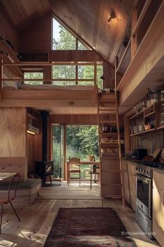 a loft with stairs leading to the upper floor