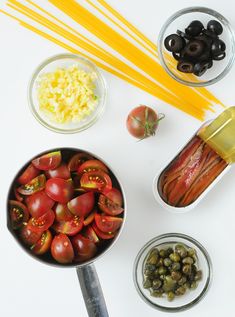 the ingredients to make this salad include tomatoes, olives, and pickles