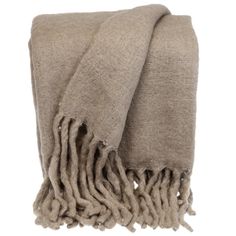 a tan blanket with fringes on top and one end folded in the same direction