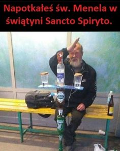 a man sitting on top of a wooden bench next to bottles of alcohol and a bag