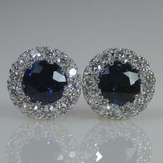 You will LOVE these little stud earrings.They are classic and chic. They are very petite style earring. The entire earring is 6.5mm wide in diameter. The blue sapphire color is beautiful and rich.The two center blue sapphire weight is .58 cts.The earrings are 6.5 mm wide.The diamonds are VS/G  Quality .18 cts total weight.The friction backs are 14k white gold.The TCW is .76 cts.The color combination of the bright white of the 18k white gold settings against the bright and intense color of the bl Luxury Sapphire Diamond Earrings With Brilliant Cut, Formal Round Cluster Earrings Fine Jewelry, Luxury Brilliant Cut Cluster Earrings As Gift, Luxury Round Cut Cluster Earrings For Anniversary, Luxury Cluster Earrings With Brilliant Cut For Gifts, Luxury Cluster Earrings For Anniversary, Luxury White Gold Sapphire Diamond Earrings, Fine Jewelry Sapphire Earrings With Diamond Cut, Formal White Gold Sapphire Diamond Earrings